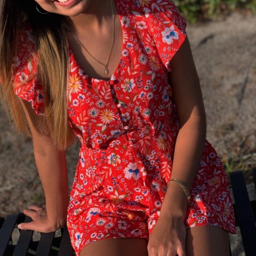 Selling red romper, size small, can fit an Xsmall.